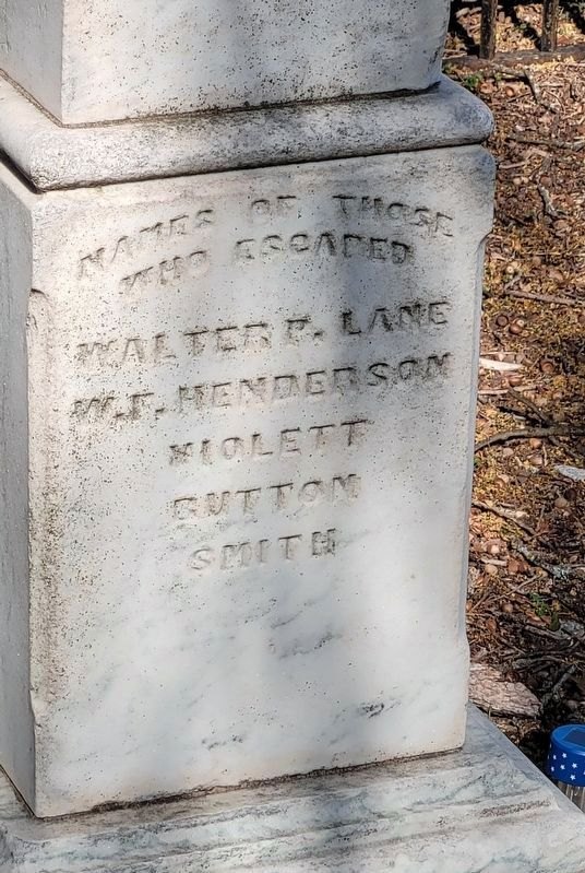 The monument side headed Names of Those Who Escaped: Walter P. Lane, W. F. Henderson, Violett, Button, Smith