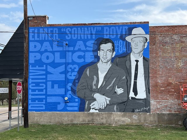 A mural of Sonny Boyd and Lee Harvey Oswald on the Blooming Grove Historical Society building, South Fordyce Street