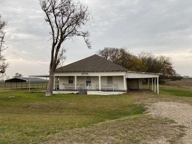 The Pelham Community Center, a low white building across the road from Wesley Chapel