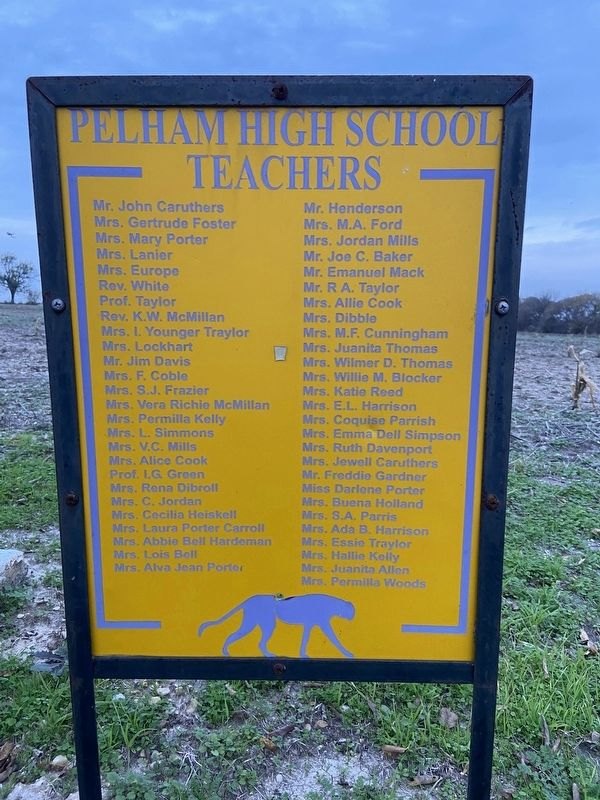A yellow signboard listing the teachers of Pelham High School