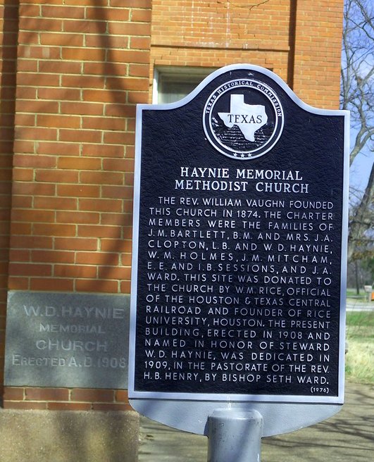 The marker for Haynie Memorial Methodist Church beside a cornerstone reading W. D. Haynie Memorial Church, Erected A.D. 1908