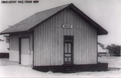 A small board-and-batten depot with a sign reading Rice, captioned T and N O Depot, Rice, Texas, 1939