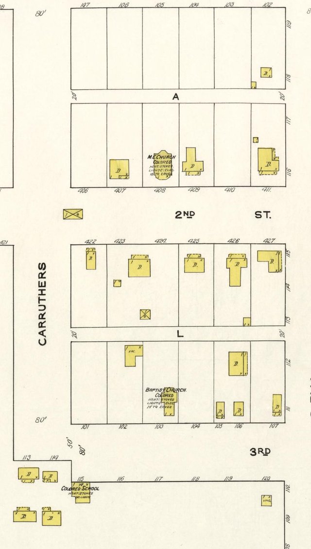 A 1921 fire-insurance map of the west side of Blooming Grove between Second and Third Streets, marking a Methodist church, a Baptist church and a school, each labelled Colored